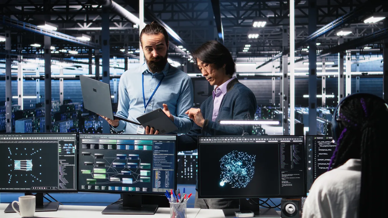 Platform engineering team reviewing cloud infrastructure dashboards