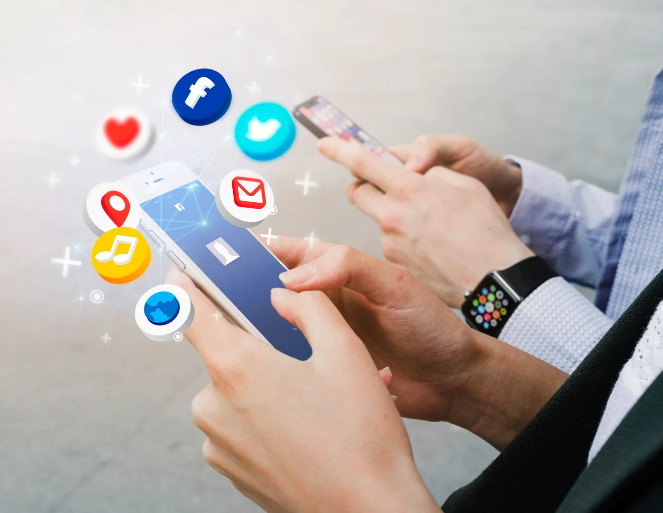 Social media engagement icons rising from a smartphone held in both hands